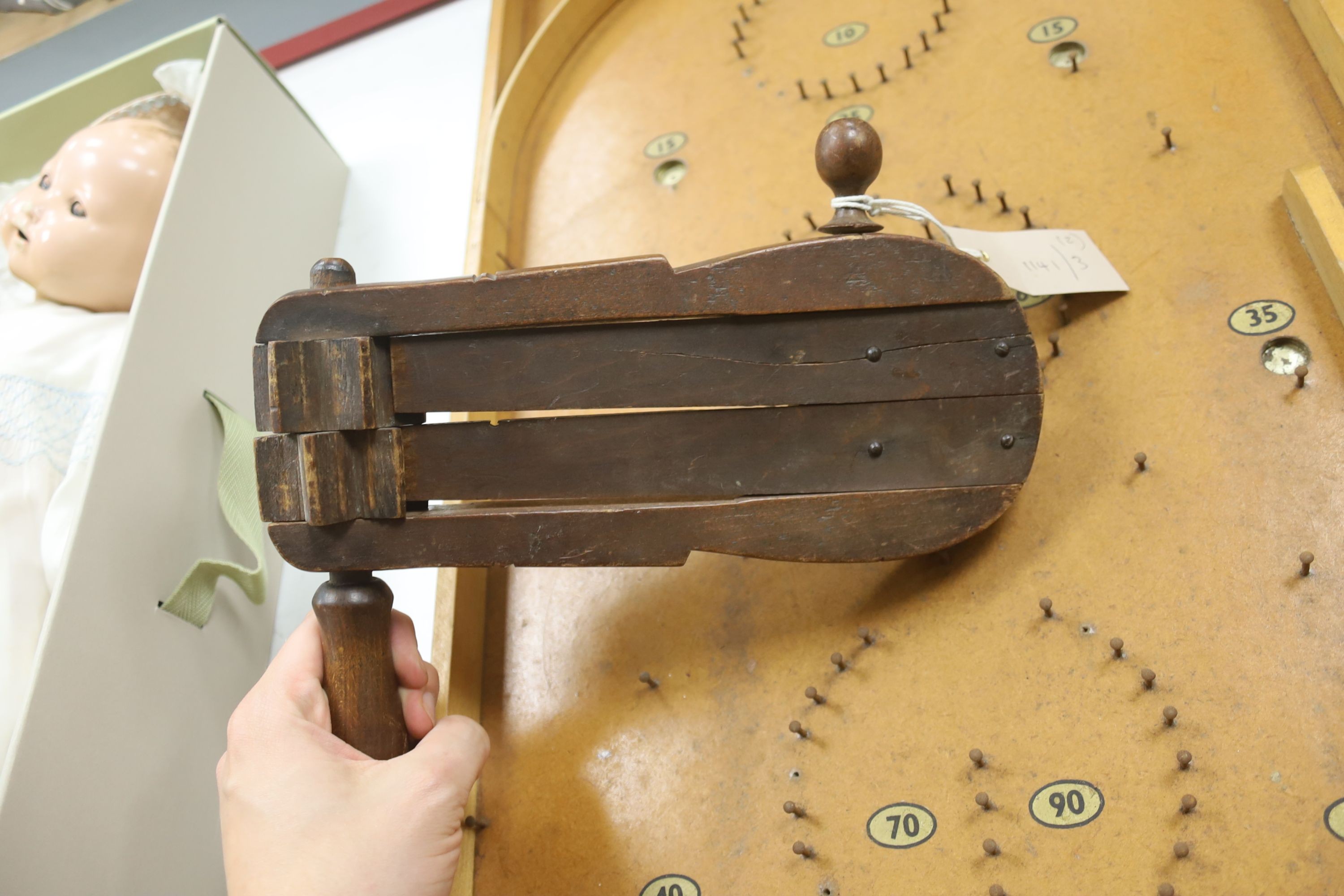 A vintage bird scarer and a Chad Valley bagatelle board